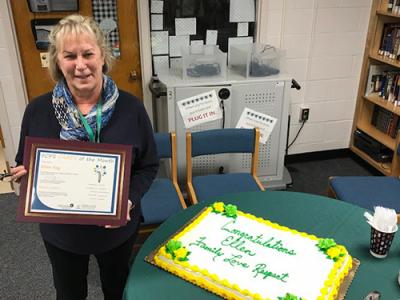 a photo of Ms. Fay with her celebratory cake